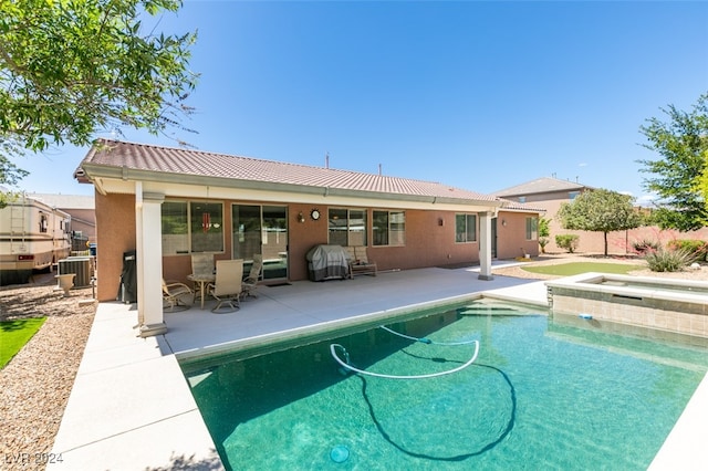 view of swimming pool featuring a patio and grilling area