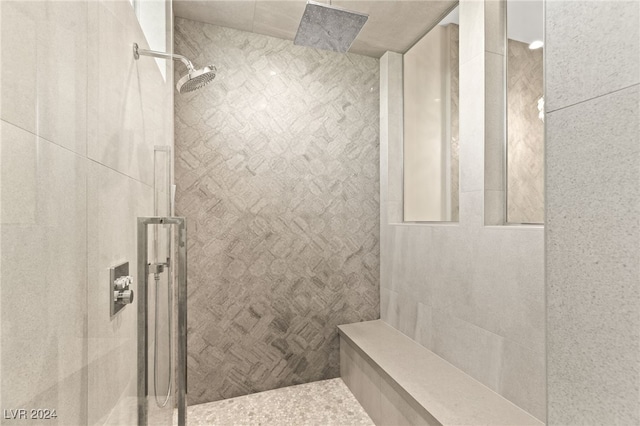 bathroom with a tile shower