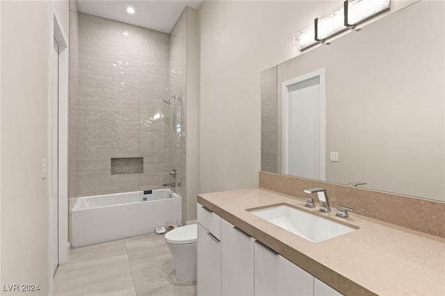 full bathroom with tiled shower / bath combo, toilet, tile patterned flooring, and vanity