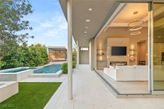 view of patio featuring a swimming pool with hot tub