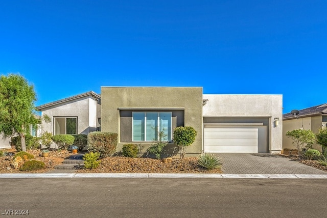 southwest-style home featuring a garage