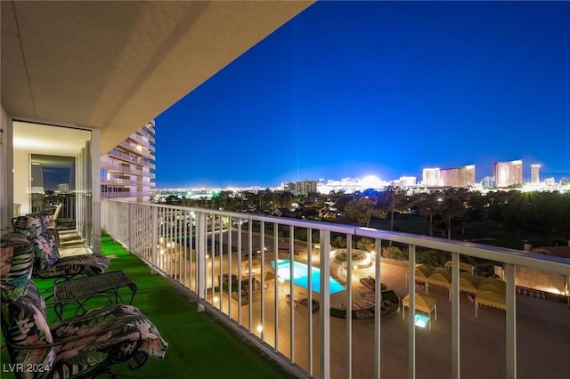 3111 Bel Air Dr Unit 8A, Las Vegas, NV 89109 - balcony at night featuring a view of city lights