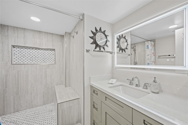 bathroom featuring curtained shower and vanity