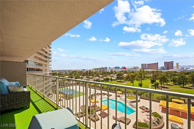 3111 Bel Air Dr Unit 8A, Las Vegas, NV 89109 - balcony featuring a city view and view of pool area