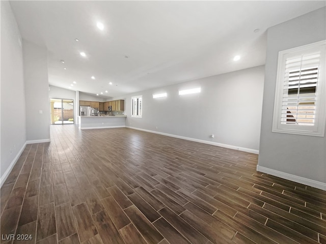 unfurnished living room featuring dark hardwood / wood-style flooring