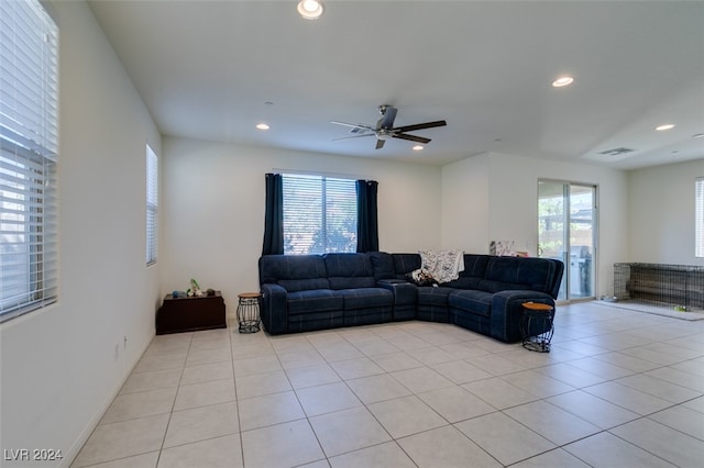 living area with recessed lighting, visible vents, and light tile patterned floors