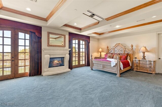 bedroom featuring multiple windows, crown molding, french doors, and a tray ceiling