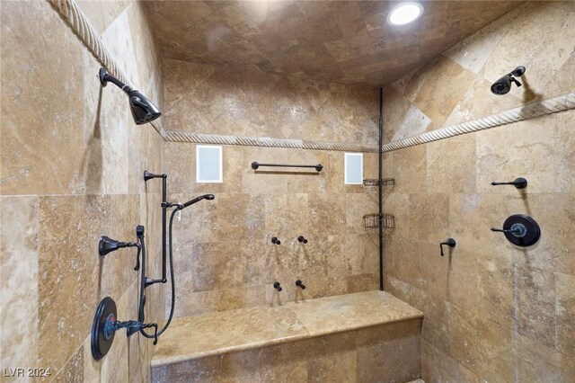 bathroom featuring tiled shower