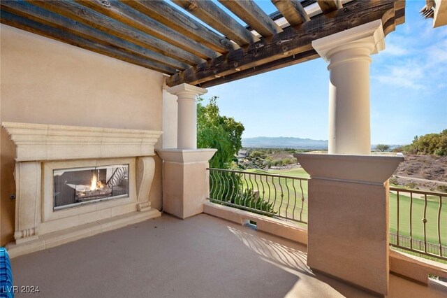 balcony featuring a pergola