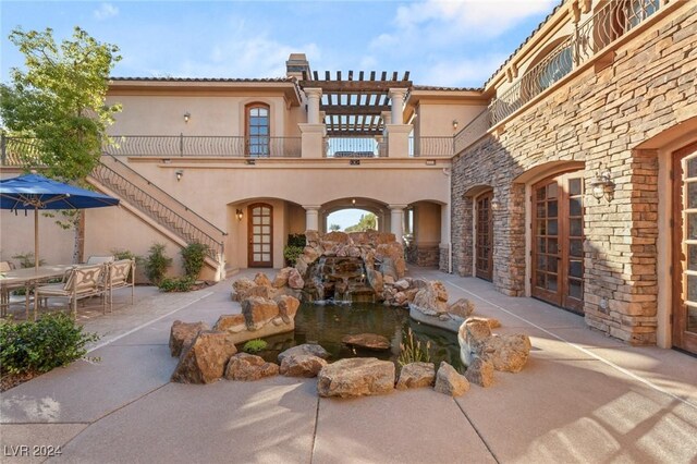 rear view of property with a patio area