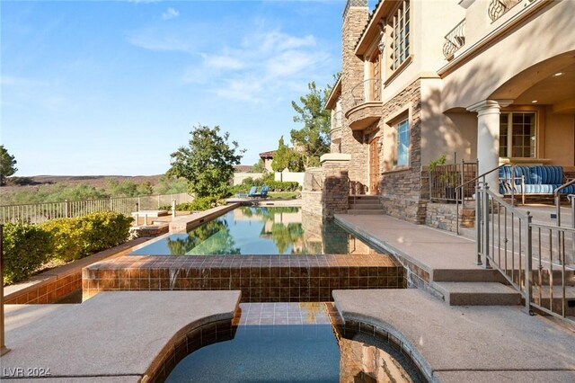 view of pool featuring a patio