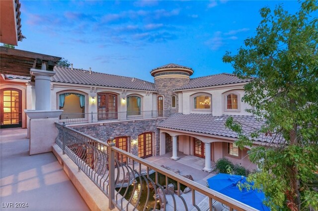 view of balcony at dusk