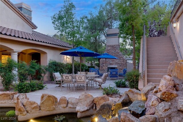 view of patio terrace at dusk