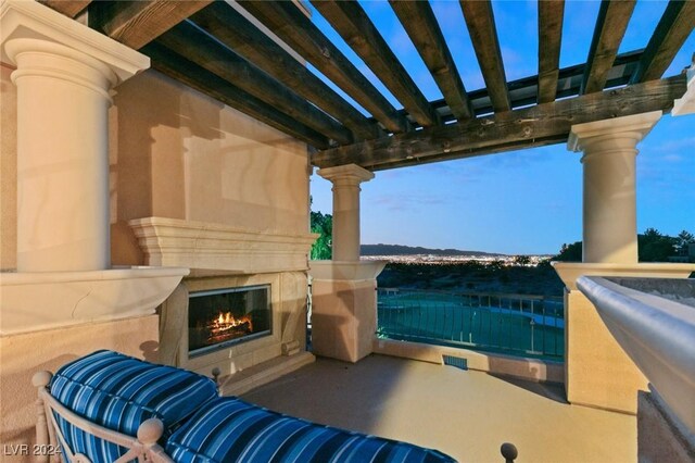 patio terrace at dusk with a pergola