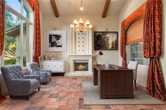 living area with beam ceiling, a notable chandelier, and a healthy amount of sunlight