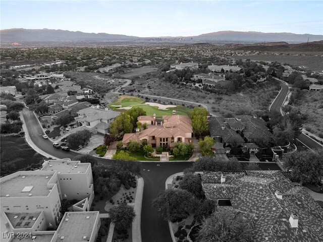 birds eye view of property featuring a mountain view