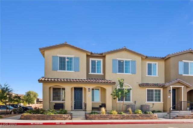 mediterranean / spanish house with central AC unit