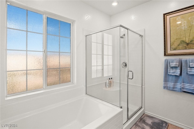 bathroom with plus walk in shower and plenty of natural light