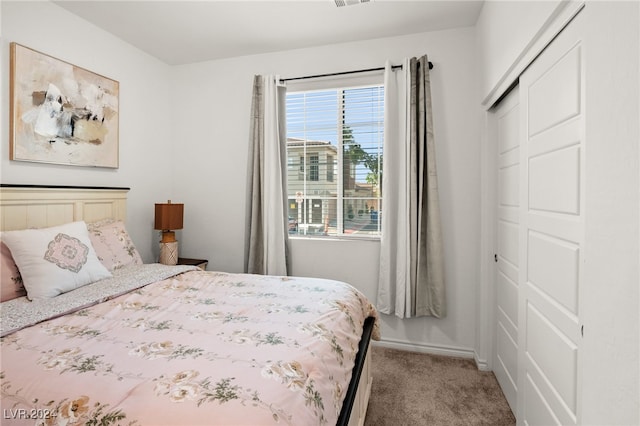 bedroom with carpet floors and a closet