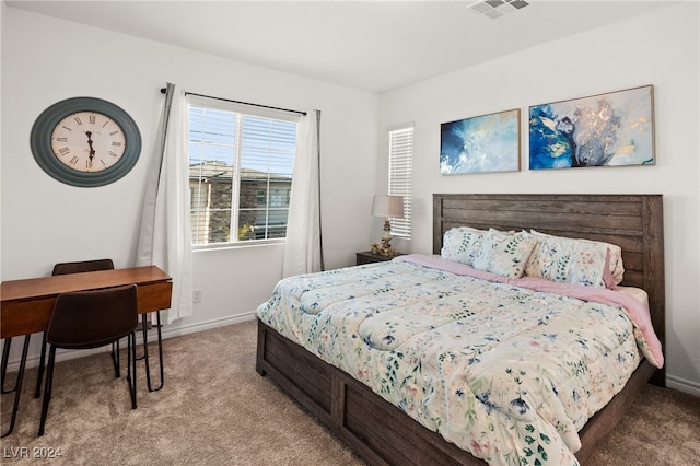 bedroom featuring light carpet