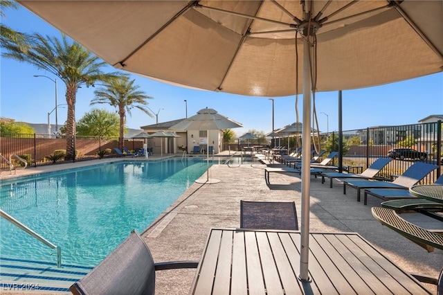 view of swimming pool featuring a patio area