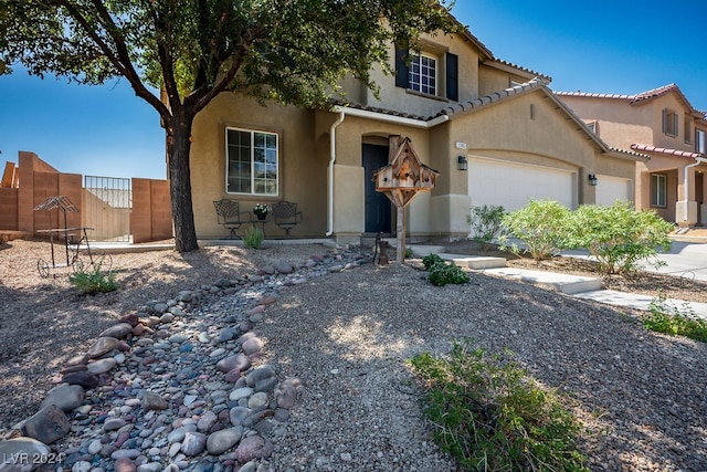 mediterranean / spanish-style house featuring a garage