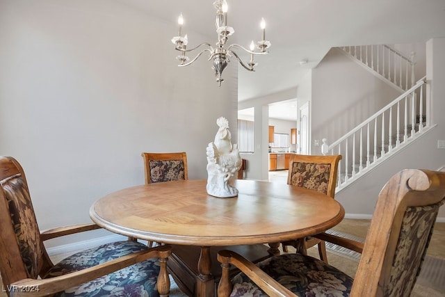 dining room with a notable chandelier and carpet floors