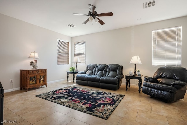 tiled living room featuring ceiling fan