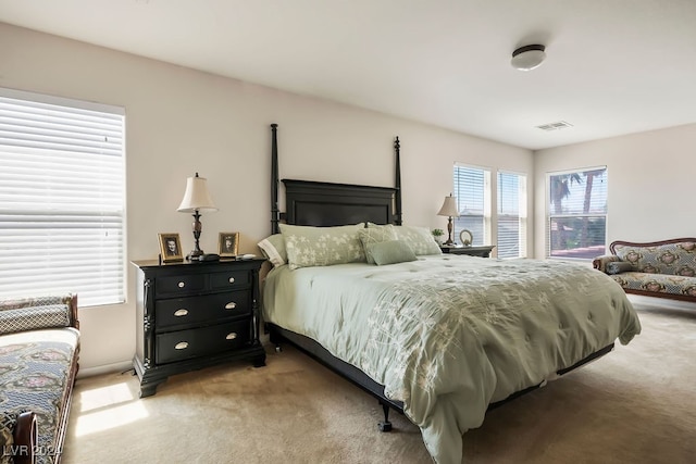 bedroom featuring light colored carpet