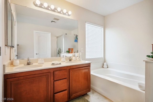 bathroom featuring vanity and plus walk in shower