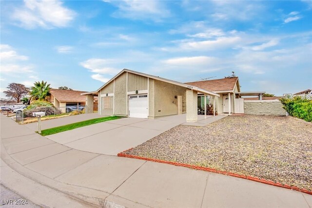 ranch-style house featuring a garage