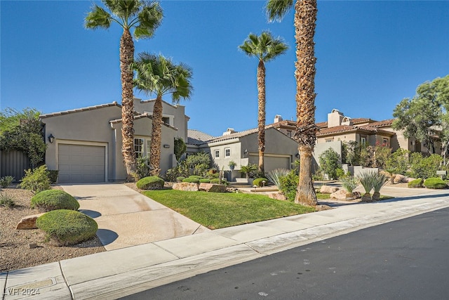 mediterranean / spanish-style house featuring a garage