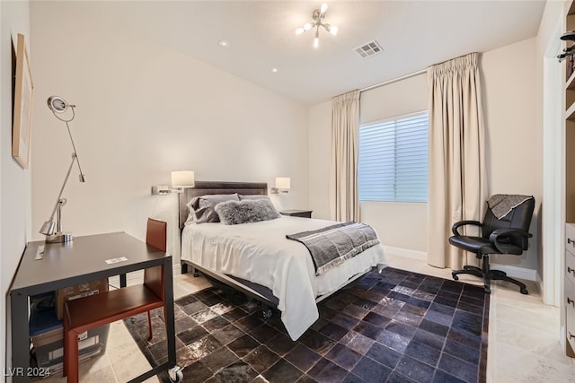 bedroom with dark tile patterned floors