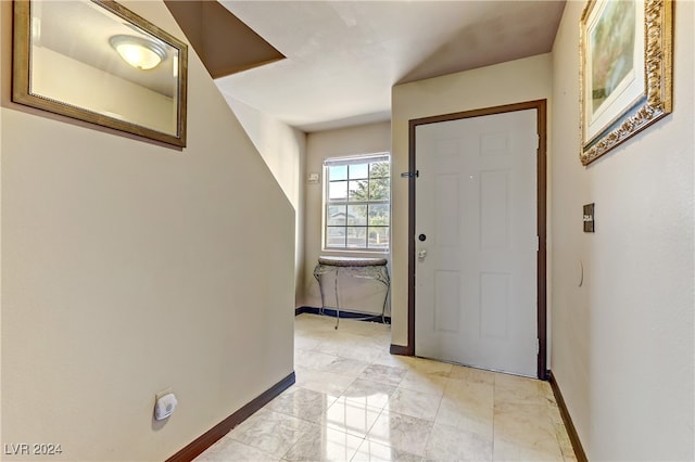 entryway featuring light tile patterned floors