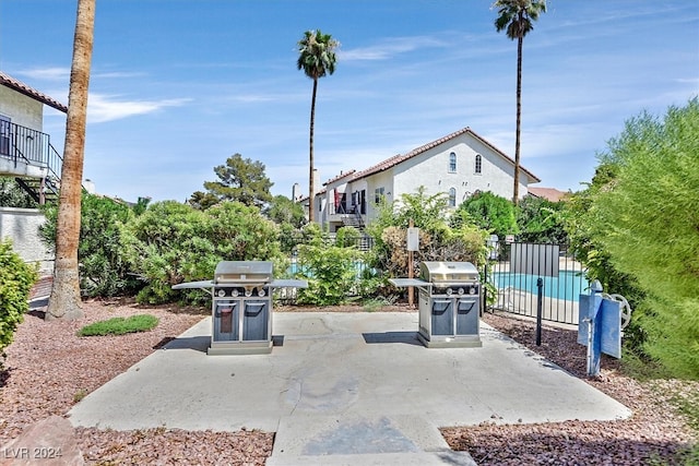 view of patio / terrace featuring a balcony and a grill