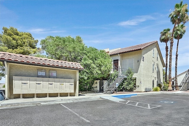 view of parking with mail boxes