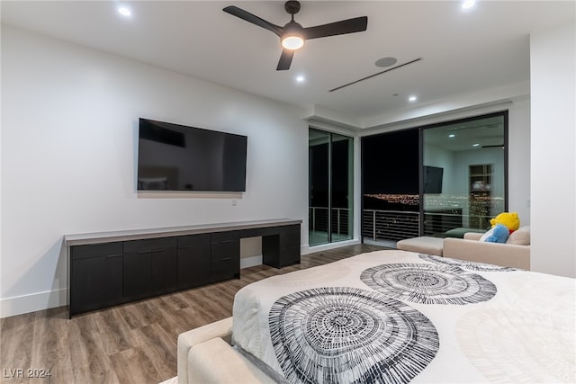 bedroom with light hardwood / wood-style flooring and ceiling fan