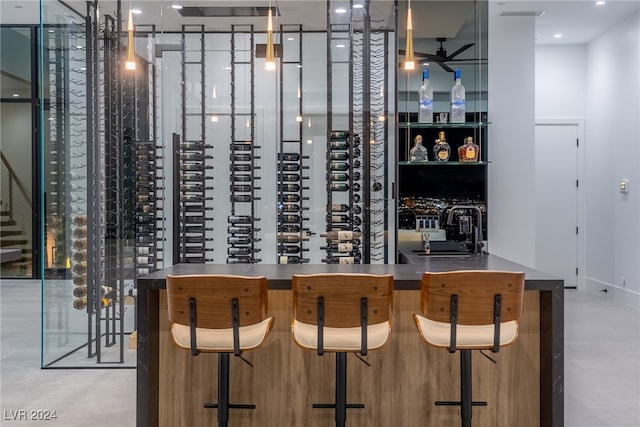 wine room featuring sink and ceiling fan