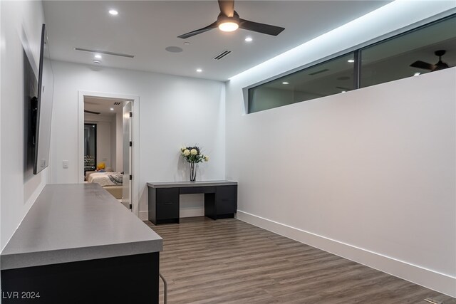 interior space featuring hardwood / wood-style flooring and ceiling fan