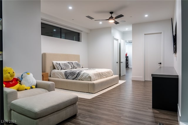 bedroom featuring ceiling fan and dark hardwood / wood-style flooring