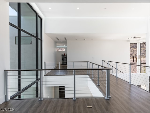 interior space featuring a healthy amount of sunlight and hardwood / wood-style flooring