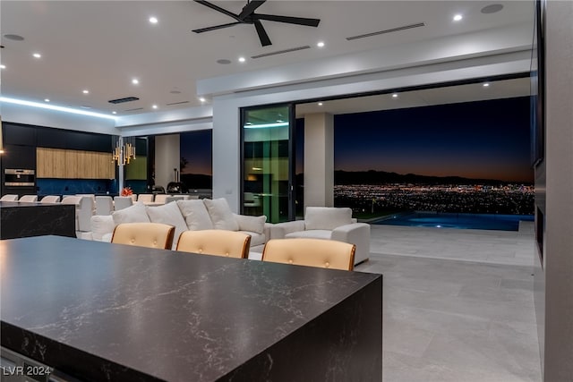 interior space featuring ceiling fan and light tile patterned flooring