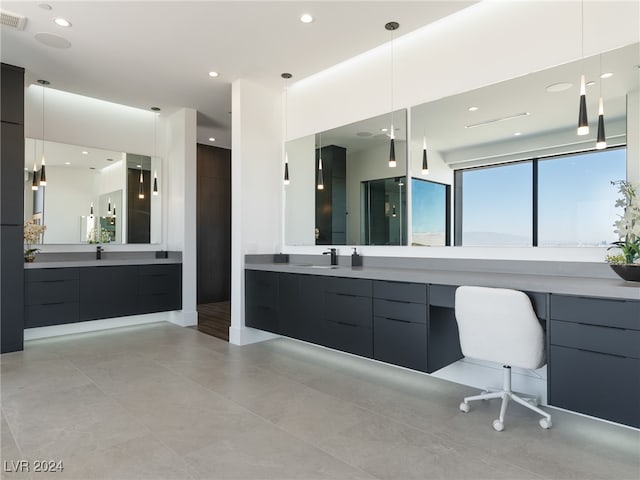 bathroom with tile patterned floors and vanity