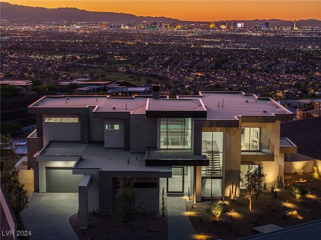 view of front of property with a mountain view and a garage