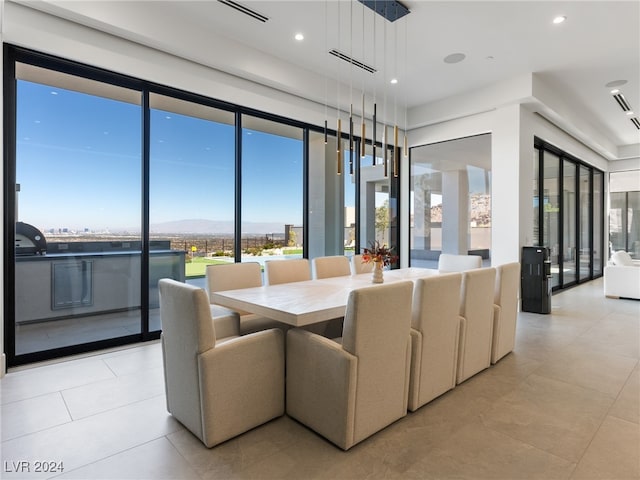 dining space featuring light tile patterned flooring