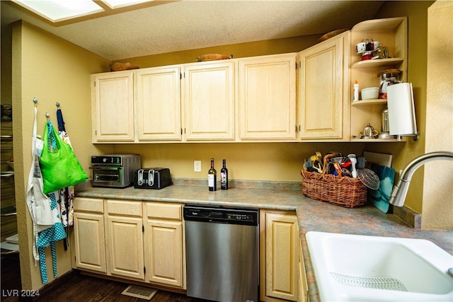 kitchen featuring sink, dark hardwood / wood-style flooring, and stainless steel dishwasher