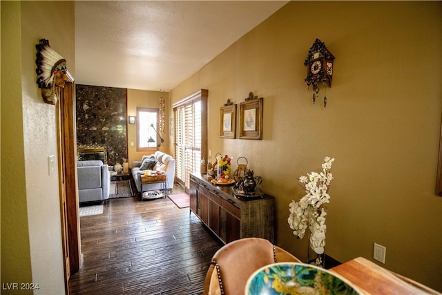 corridor with hardwood / wood-style flooring