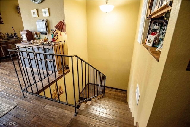 stairs with wood-type flooring