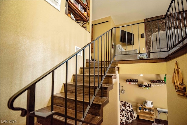 stairway featuring hardwood / wood-style flooring