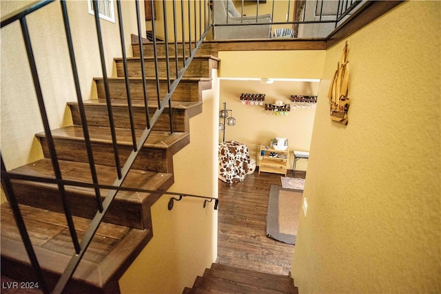 staircase featuring hardwood / wood-style flooring